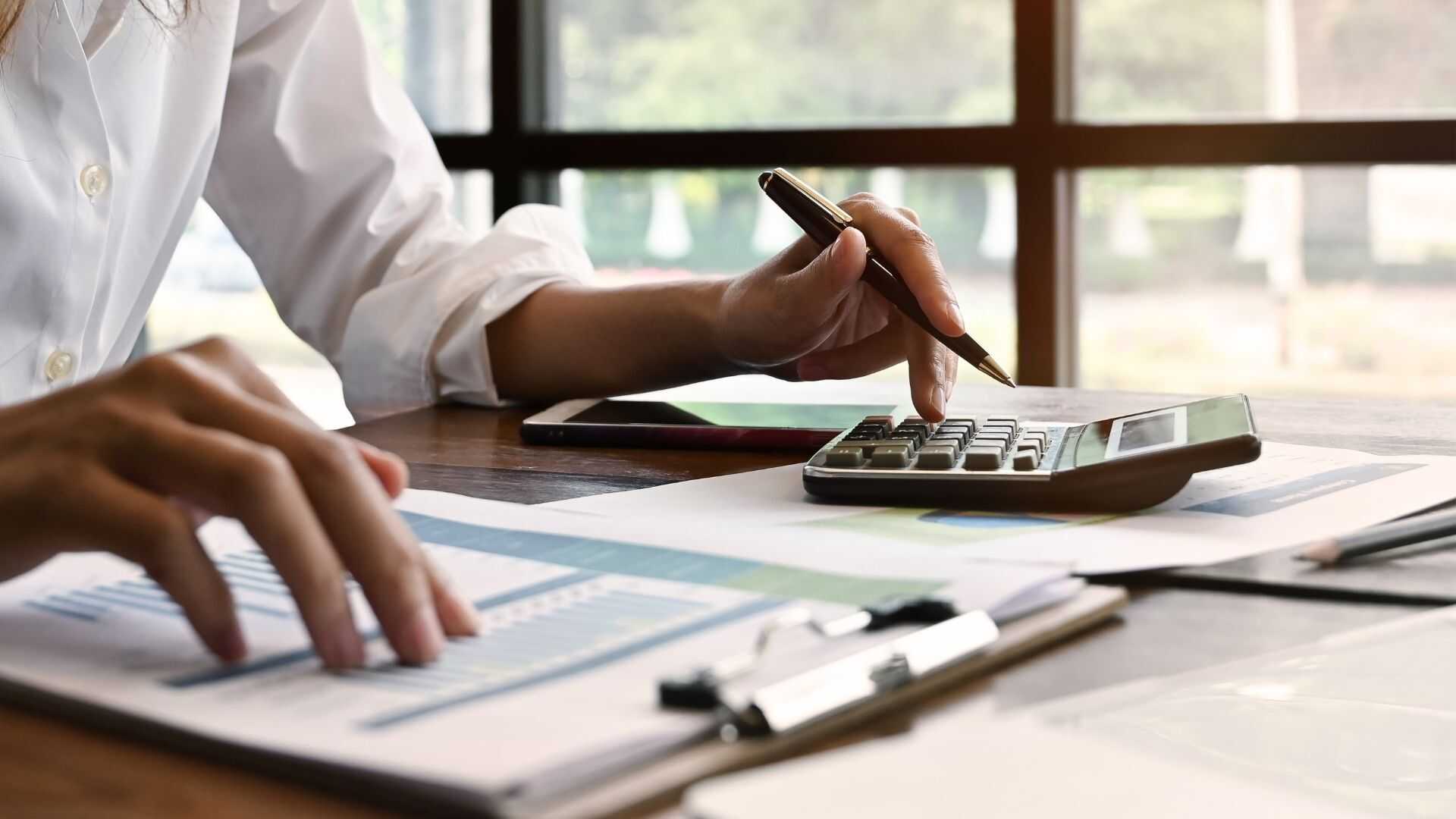 Logistics specialist inspecting and tallying a secure commercial air freight shipment before charter cargo departure.